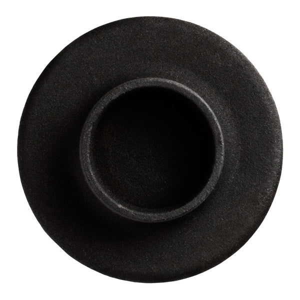 Round black ceramic vase with a smooth matte finish and subtle texture, embodying minimalist design.