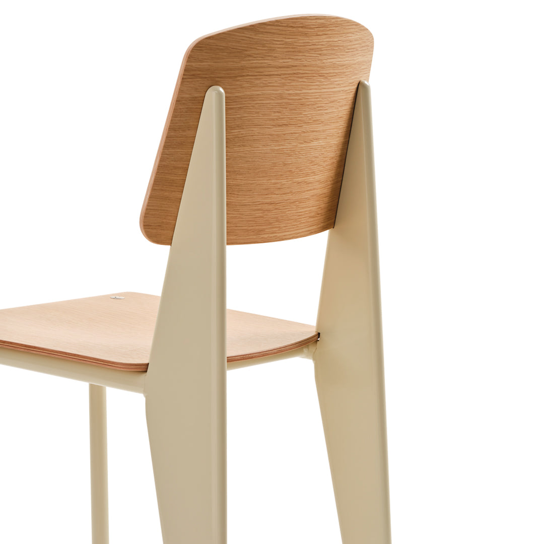 Light beige chair with a smooth wooden backrest and clean, modern design. Subtle wood grain pattern adds elegance.