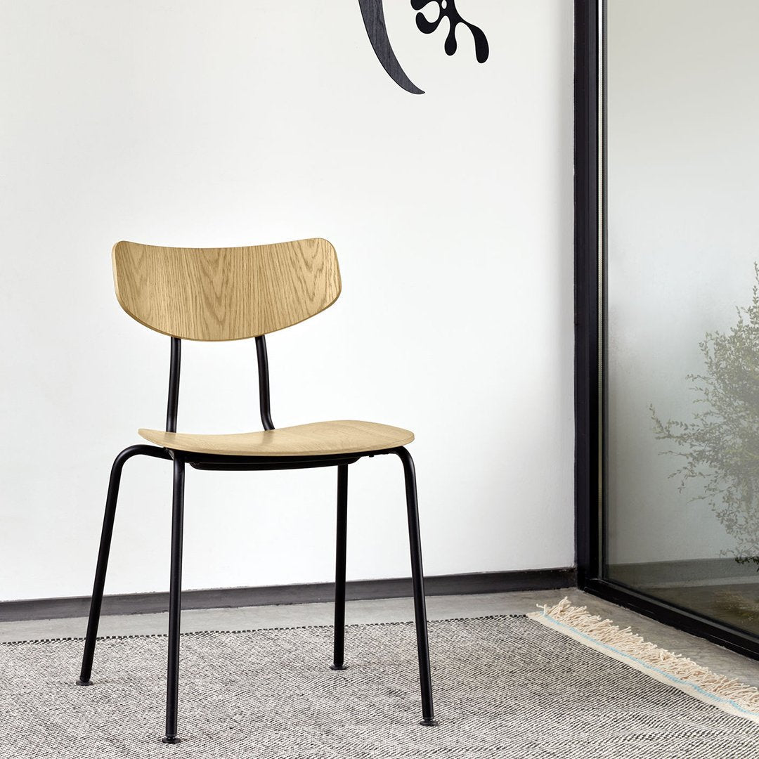 Natural wood finish with a smooth grain pattern, paired with sleek black metal legs. Modern minimalist design.