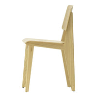 Side view of a minimalist wood chair in light beige with smooth, clean lines and natural grain texture.