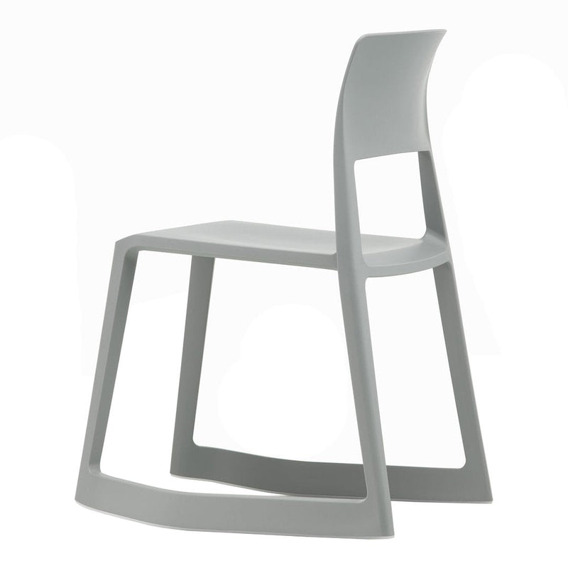 Gray modern chair with a minimalist design and smooth finish, featuring a sleek, angular silhouette.