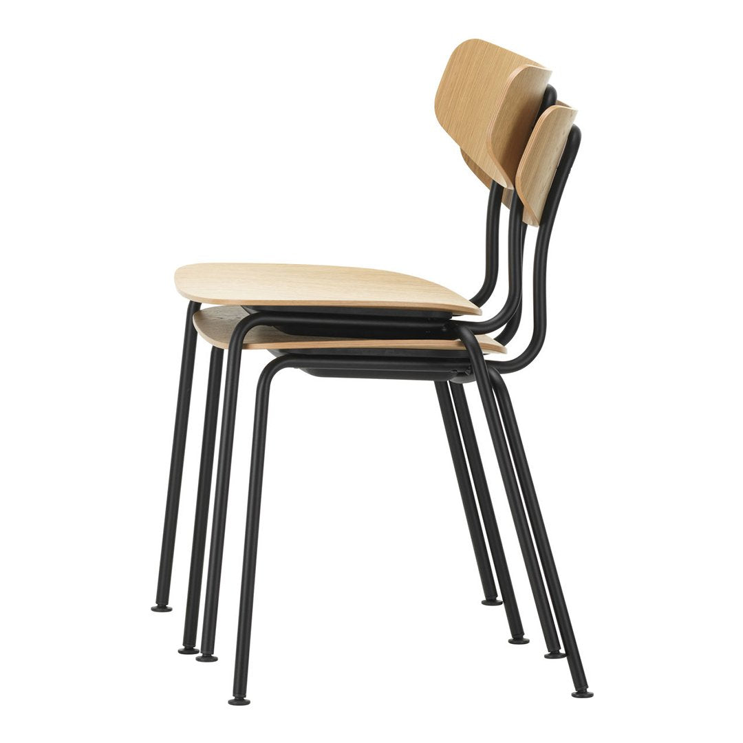 Stack of three modern chairs featuring a light wood seat and backrest with sleek black metal frames.