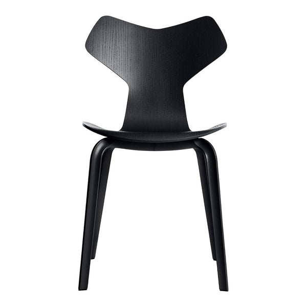 Stylish black chair with a sleek, modern design and minimalistic shape, perfect for contemporary interiors.