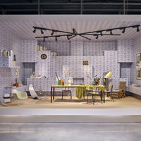 Interior setting featuring a blue and white floral wallpaper pattern, with natural wood and green accents.
