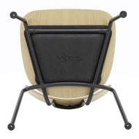 "Modern wooden chair with a natural finish, black seat cushion, and sleek black metal legs."