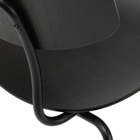Black curved chair featuring a smooth wooden surface and sleek black metal legs. Modern minimalist design.