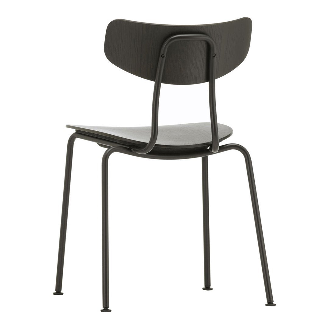 Black chair with a minimalist design featuring smooth curves and a matte finish. Ideal for modern decor.