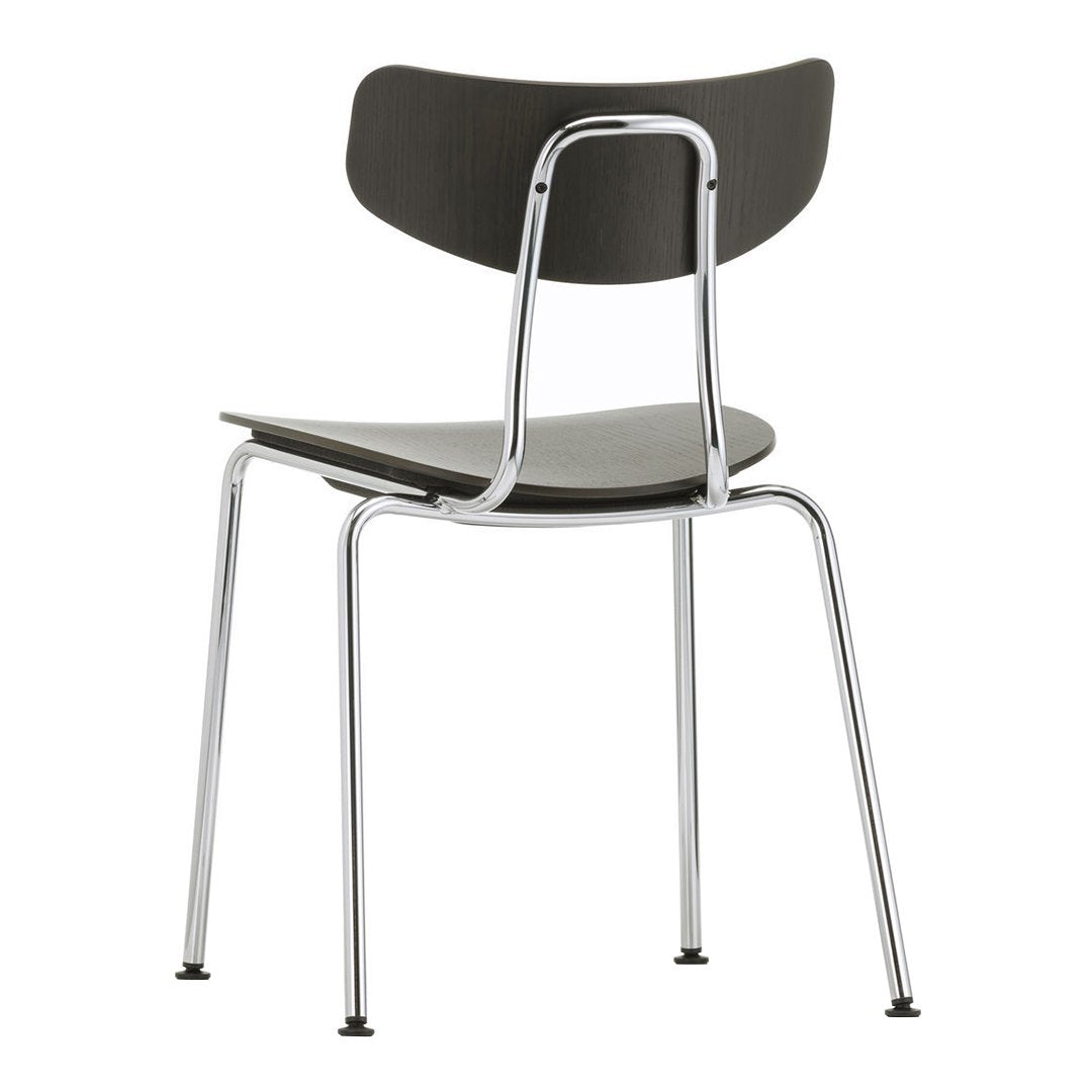 Modern black chair with a minimalist design and chrome legs, featuring smooth surfaces and a simple, sleek silhouette.