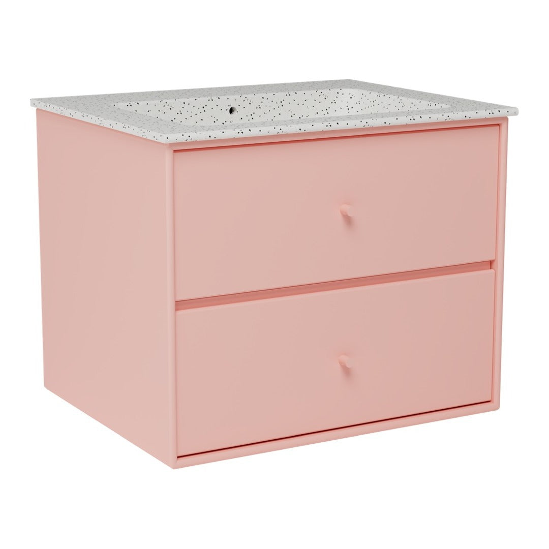 Pink bathroom vanity with two drawers and a speckled white countertop. Modern and minimalistic design.