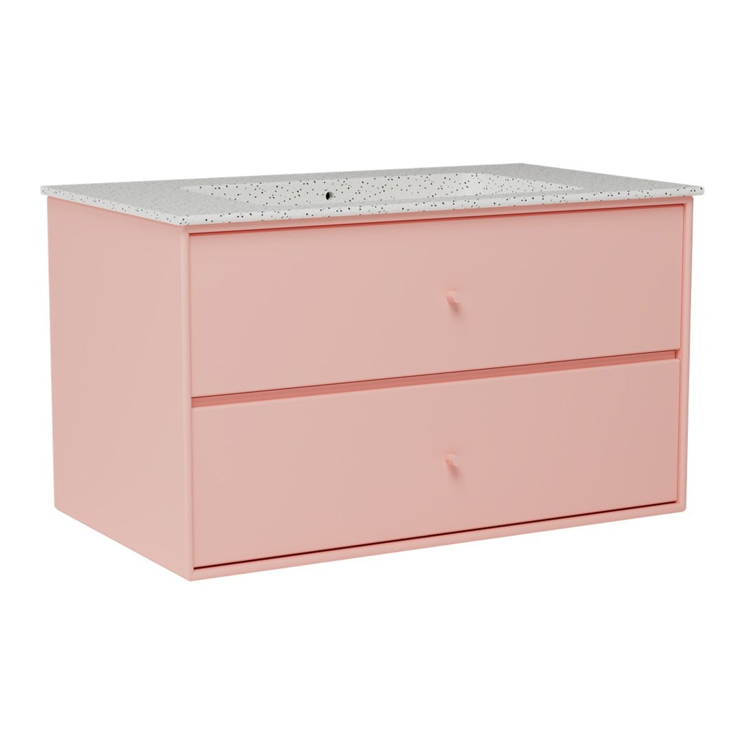Pink dresser with two drawers and a speckled white countertop design. Ideal for modern decor styling.