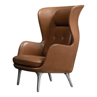 Brown leather armchair with a smooth finish and sleek, modern design. Features a high back and silver legs.