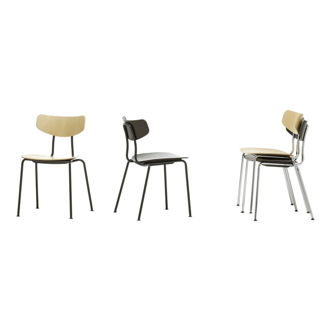 Stackable chairs in natural wood and black, featuring sleek metal legs and minimalist design. Perfect for modern spaces.