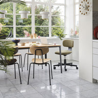 Modern dining area featuring a mix of wood tones, olive green upholstery, and sleek gray marble flooring.