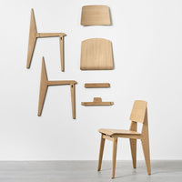 Light wood chair with a smooth finish, showcasing minimalist design and natural grain patterns.