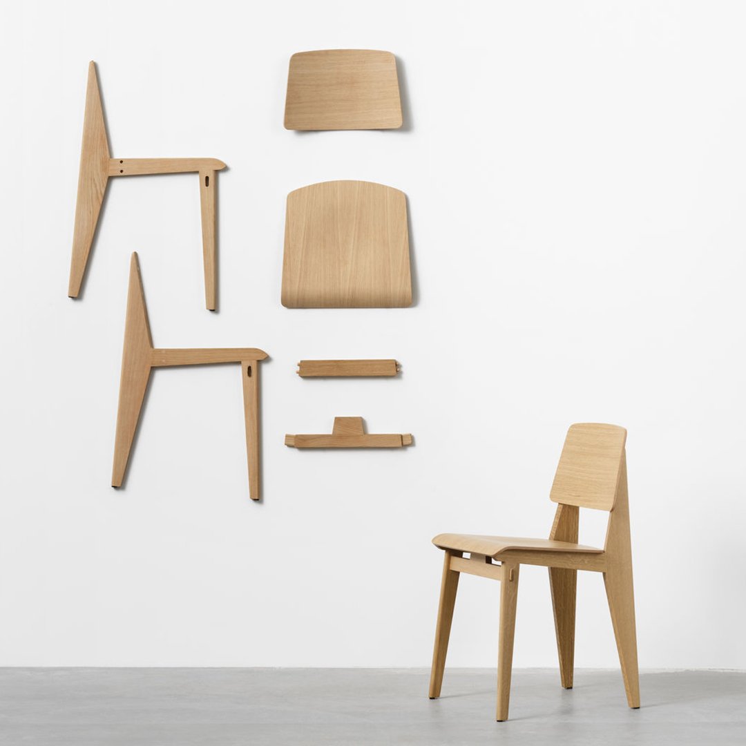 Light wood chair with a smooth natural finish, showcasing minimalist design and simple geometric shapes.