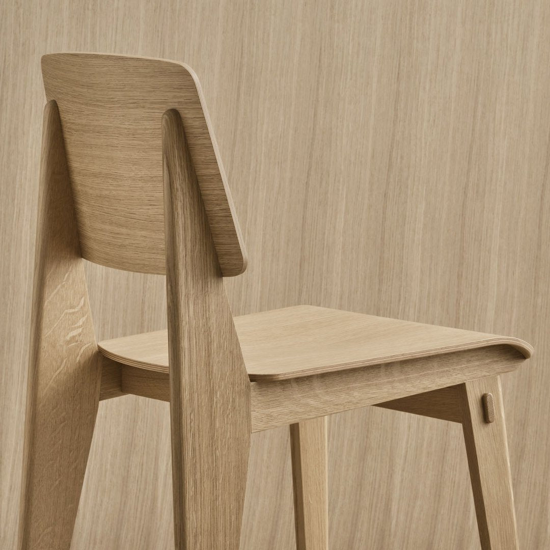 Light wood chair with a minimalist design, featuring a smooth, natural finish and subtle grain patterns.