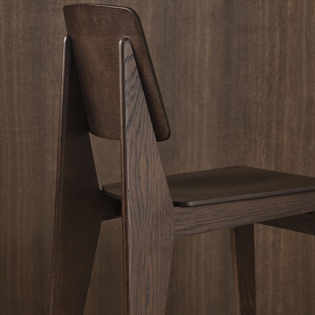 Modern dark wood chair with a sleek, minimalist design, featuring rich brown tones and smooth, clean lines.