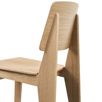 Natural wood chair with a smooth light oak finish and minimalist design, highlighting clean lines and warm tones.