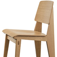 Natural wood chair with a sleek, minimalist design featuring light oak color and clean, smooth surfaces.