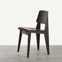Dark brown wood chair with a minimalist design and smooth, clean lines against a light background.