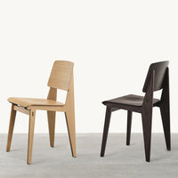 "Two wooden chairs: one in natural oak, the other in dark walnut, showcasing minimalistic design and smooth finishes."