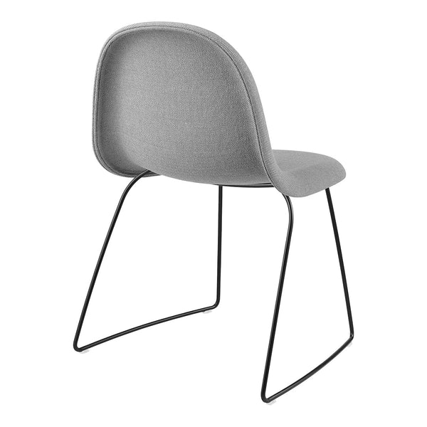 Gray upholstered chair with a sleek black metal frame. Modern design, smooth texture, minimalist style.