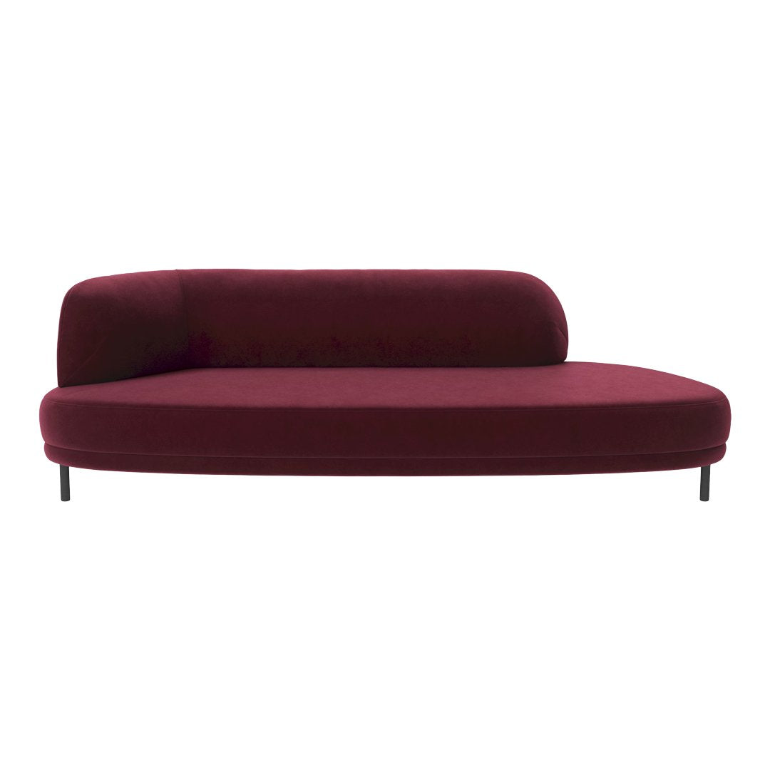 Burgundy curved sofa with smooth upholstery and minimalist design, featuring sleek black legs.