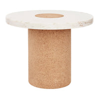 Round white marble top table with a textured cork base, featuring a circular cutout in the marble.
