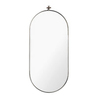 Oval wall mirror with a sleek gold frame, reflecting a minimalistic and modern design. Ideal for any decor.