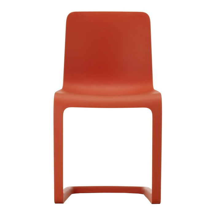Vibrant orange chair with a sleek, minimalist design and smooth, solid color finish. Perfect for modern spaces.