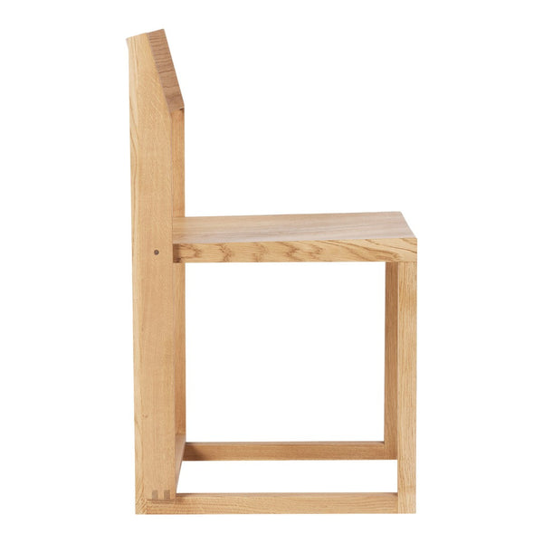 Natural wood chair with a minimalist design, showcasing light beige hues and smooth, simple lines.