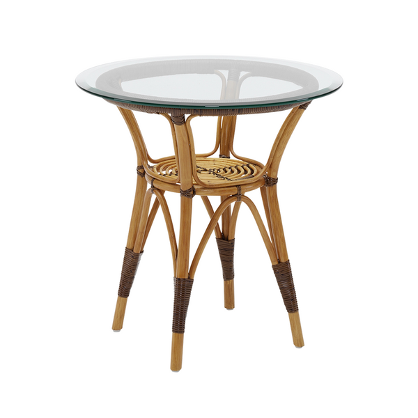 Round rattan side table with natural bamboo finish and clear glass top, featuring woven textures and earthy tones.