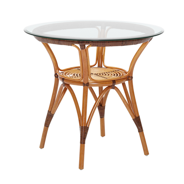 Round wicker dining table with a natural bamboo finish and a clear glass top, featuring intricate woven patterns.
