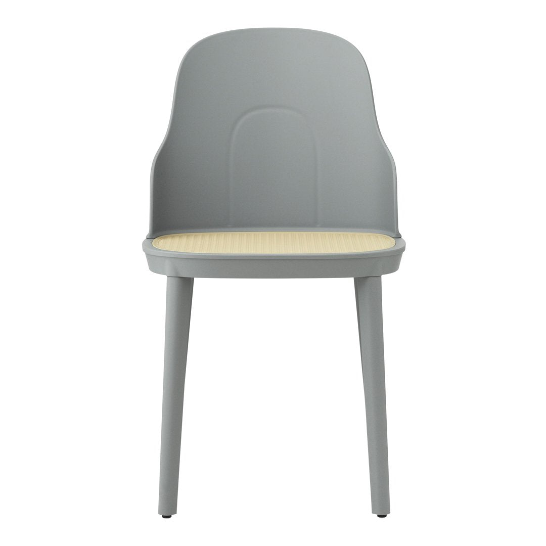 Gray chair with a smooth, contemporary design and a light yellow patterned seat. Ideal for modern interiors.