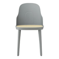 Gray chair with a smooth, contemporary design and a light yellow patterned seat. Ideal for modern interiors.