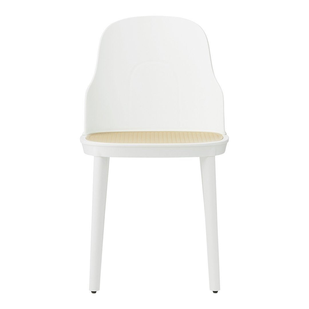 White chair with a smooth finish and a natural cane-patterned seat. Modern and minimalist design.
