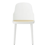 White chair with a smooth finish and a natural cane-patterned seat. Modern and minimalist design.