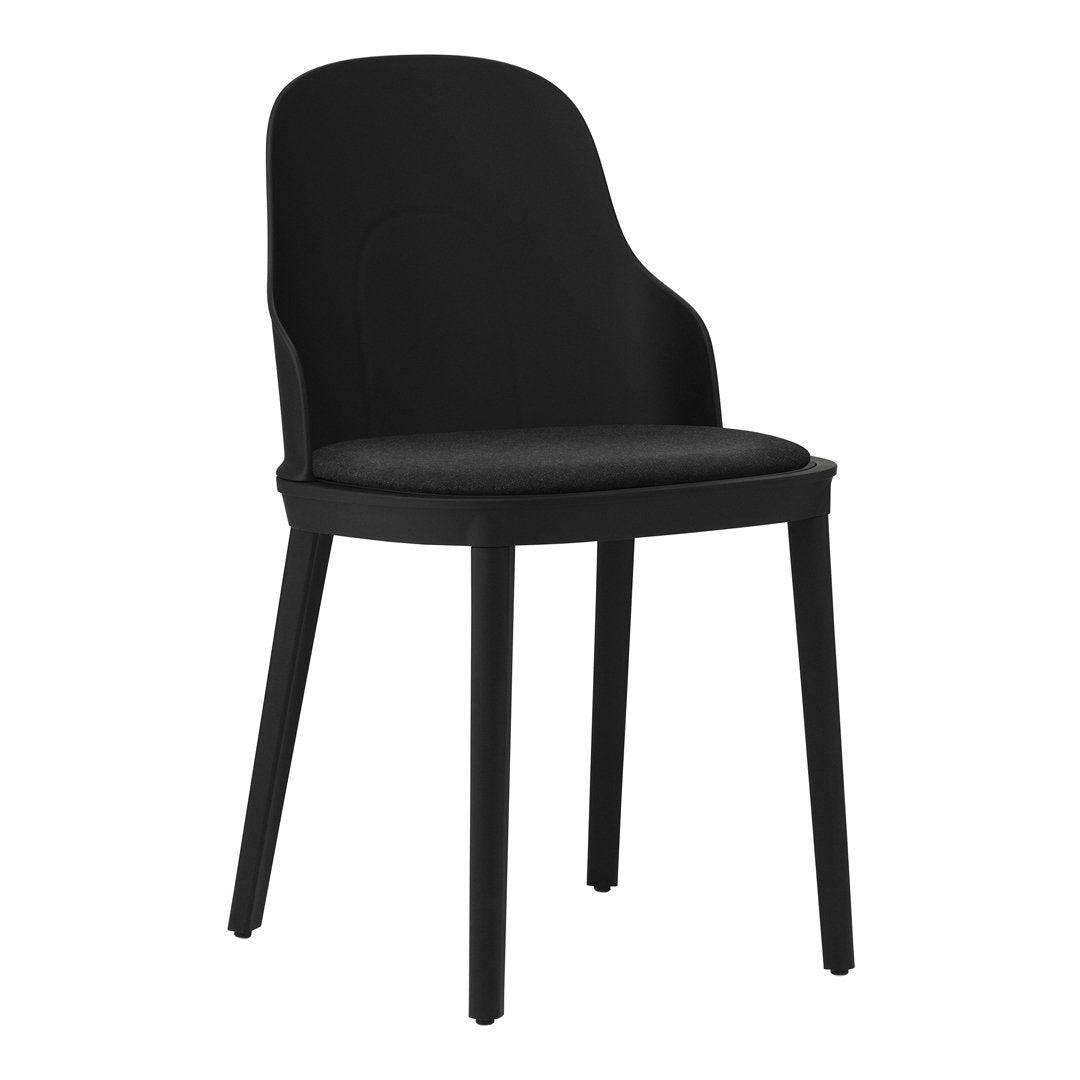 Black upholstered chair with a sleek, modern design and minimalistic style. Perfect for contemporary interiors.