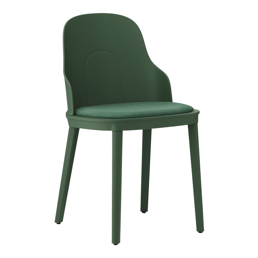 Green molded chair with a smooth finish and matching padded seat, perfect for modern decor.