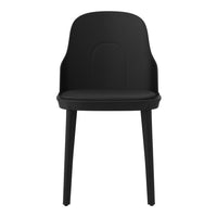 Black minimalist chair with a sleek, smooth finish and curved backrest, perfect for modern decor.
