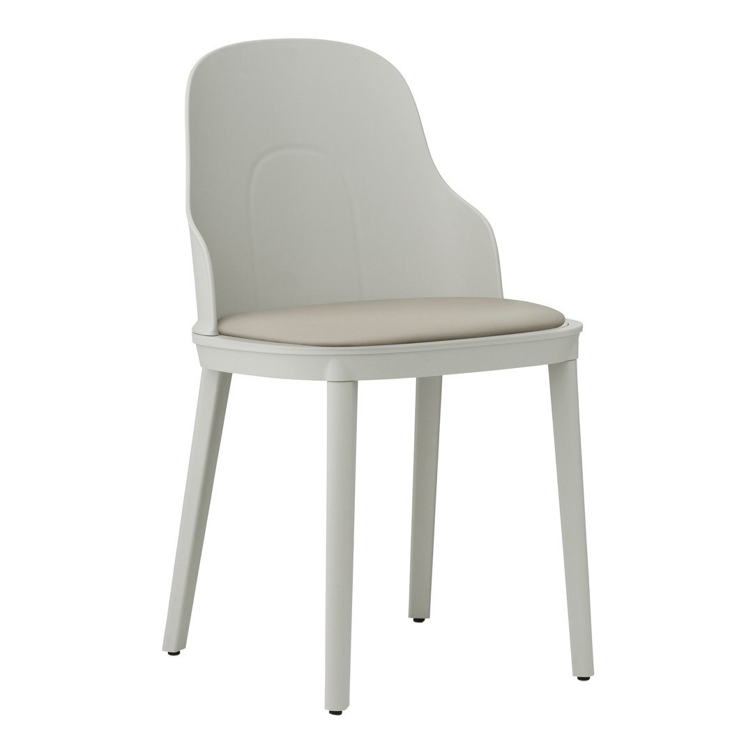 Light grey chair with a soft beige cushion, featuring a smooth, minimalist design ideal for modern decor.