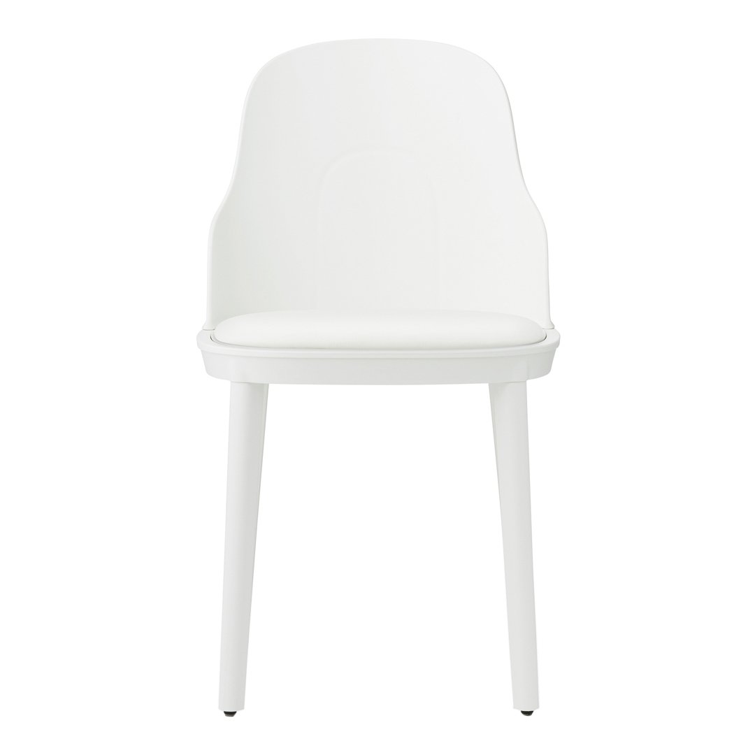 White, minimalist chair with a sleek design and smooth surfaces, perfect for modern decor. No patterns.