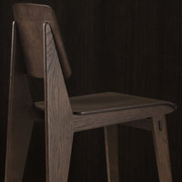 "Solid dark wood chair with clean lines and a minimalist design, featuring a rich, deep brown finish."