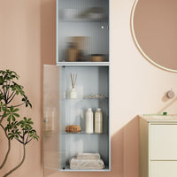 Light blue cabinet with textured glass doors against a soft pink wall, featuring minimalist decor and clean lines.