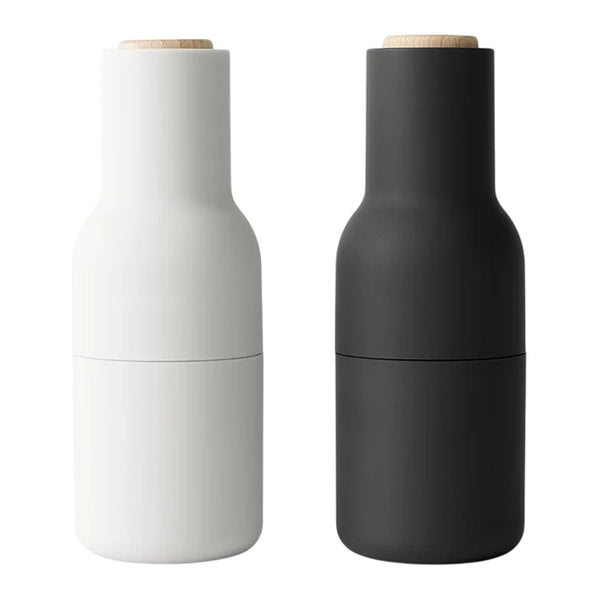 Matte black and white spice grinder set with natural wood tops, sleek modern design. Perfect for kitchen decor.