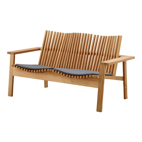 Natural wood tones with a sleek beige cushion; features distinctive slatted back design for modern elegance.