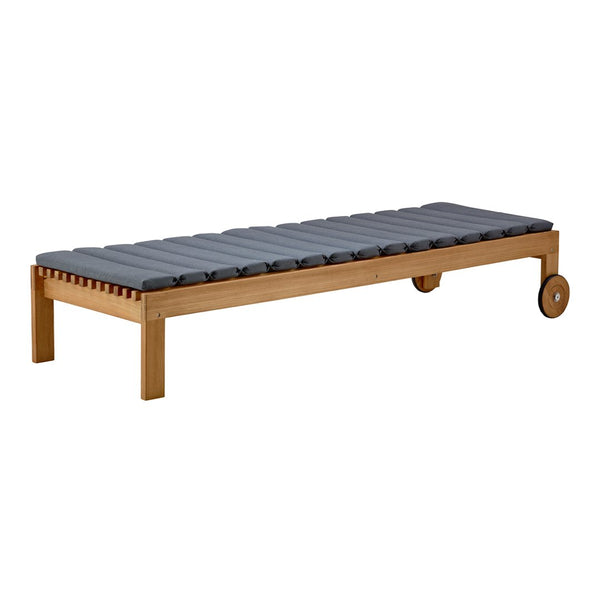 Gray cushioned outdoor lounge bed with a natural wood frame and subtle horizontal slat pattern.