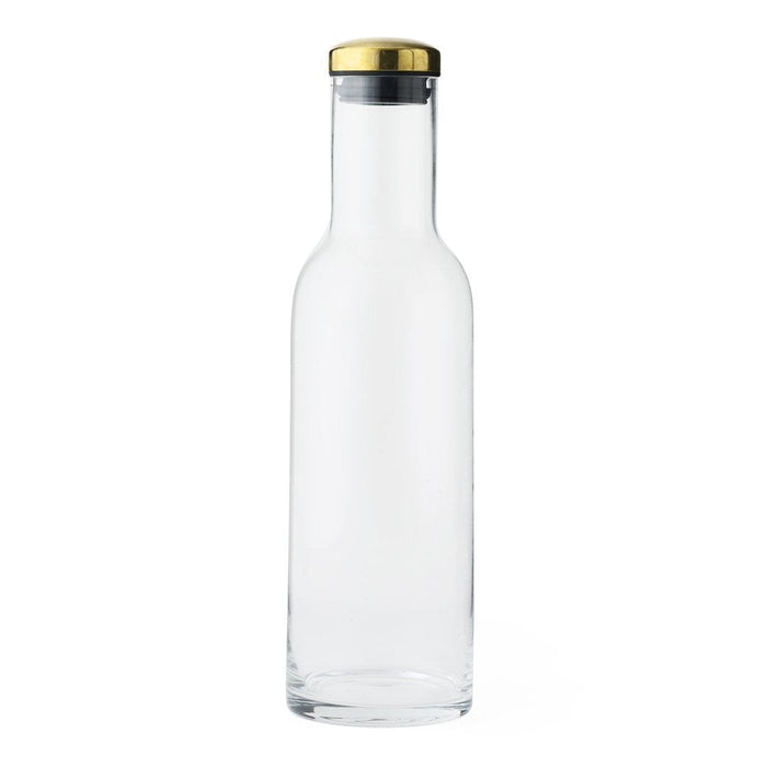 Clear glass bottle with a sleek shape, featuring a gold and silver cap for a modern touch.