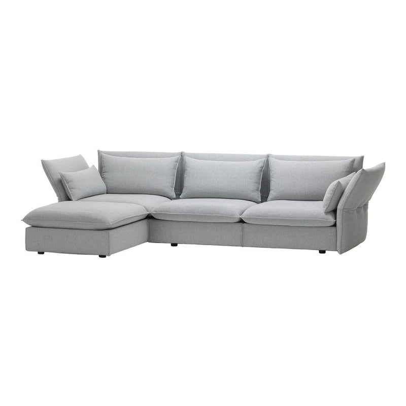 Light gray sectional sofa with smooth fabric and minimalistic design, featuring plush cushions for added comfort.
