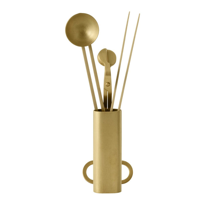 Elegant gold kitchen utensil holder with various golden tools, showcasing a sleek, modern design.